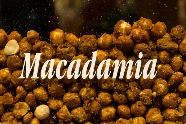 Roasted nuts in sugar. Macadamia. — Stock Photo, Image