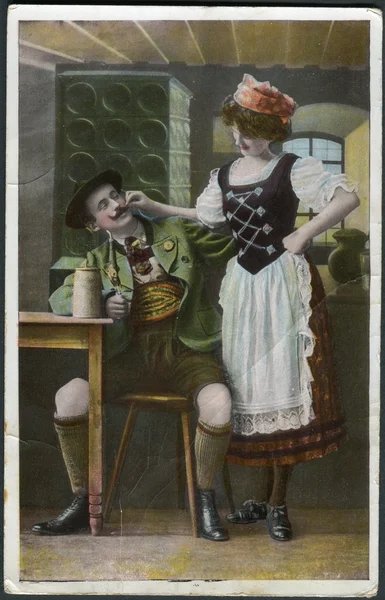 Old German postcard 1912. Shows a Bavarian restaurant, a visitor and a waitress. — Stock Photo, Image