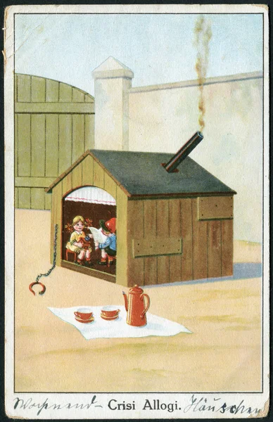 Alte italienische Postkarte aus dem Jahr 1930. zeigt die im Hundehaus lebenden Kinder. die Inschrift auf italienisch: Wohnungskrise. — Stockfoto