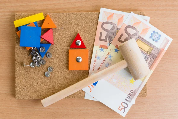 Small house of the children's designer and money. — Stock Photo, Image