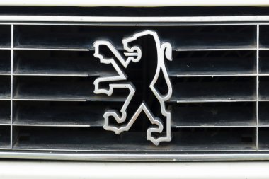 Emblem small family car Peugeot 305 clipart