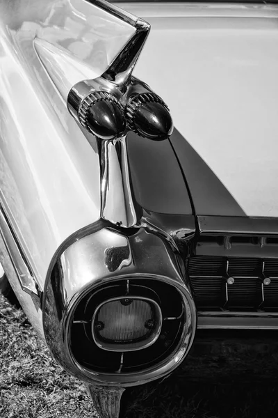 The rear brake lights Full-size luxury car Cadillac Sixty Special Fleetwood, rear view, black and white — Stock Photo, Image