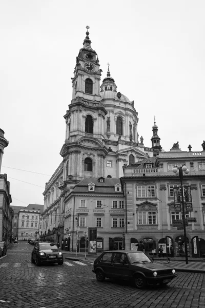 The streets of old Prague. Saint Nicholas Cathedral. Stylized film. Large grains. Black and white — Stock Photo, Image