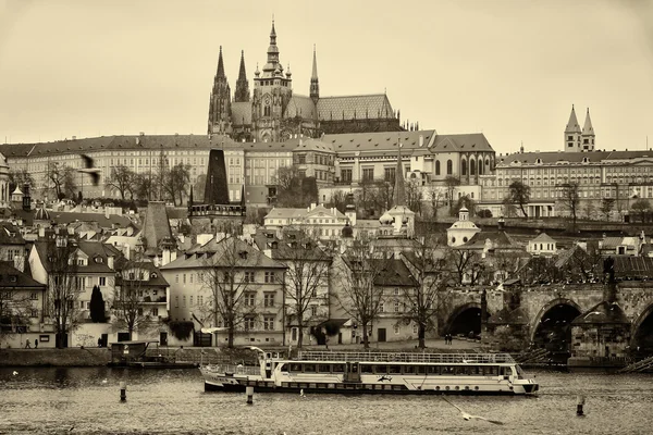 View of old Prague and St. Vitus Cathedral. Sepia. Stylized film. Large grains — Stock Photo, Image