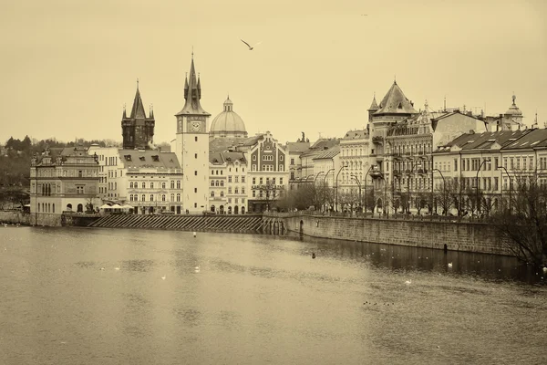 House of old Prague and Vltava river. Sepia. Stylized film. Large grains. — Stock Photo, Image