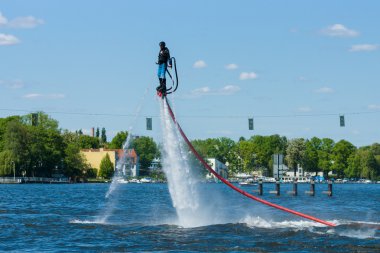 Demonstration performance at Flyboard. 2nd Berlin water sports festival in Gruenau. clipart