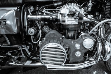 BERLIN, GERMANY - MAY 17, 2014: Engine of the motorcycle Munch Mammoth 1200 TTS. Black and white. 27th Oldtimer Day Berlin - Brandenburg clipart
