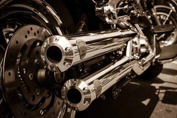 BERLIN, GERMANY - MAY 17, 2014: Exhausts of motorcycle Harley Davidson Softail. Rear view. Sepia. 27th Oldtimer Day Berlin - Brandenburg — Stock Photo, Image