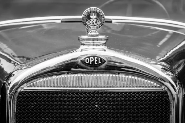 BERLIN, GERMANY - MAY 17, 2014: Hood ornament of the Opel 1.2-litre Cabrio-Limousine (1934). Black and white. 27th Oldtimer Day Berlin - Brandenburg — Stock Photo, Image