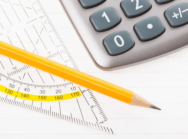 Close-up of protractor, calculator, and pencil — Stock Photo, Image