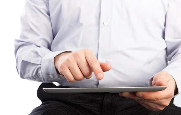 Young adult working on a digital tablet Stock Photo