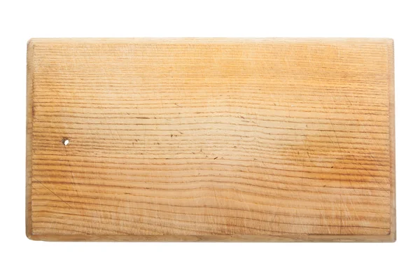 Old worn and scratched wooden cutting board — Stock Photo, Image