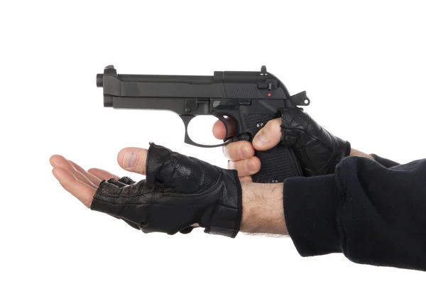 Robber with gun holding out hand — Stock Photo, Image