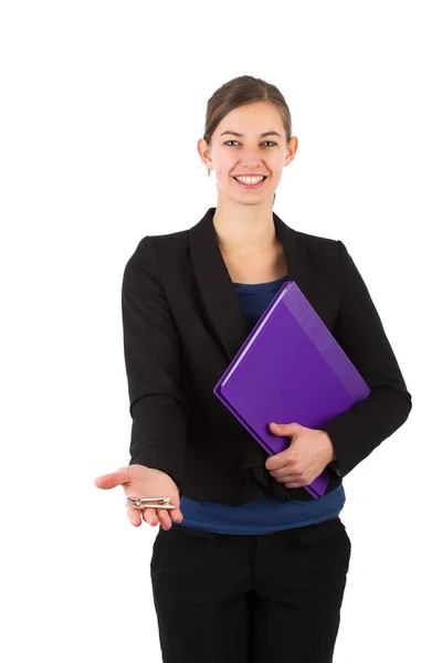 Real estate agent holds out a key — Stock Photo, Image