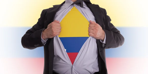 Affärsman med colombianska flagga t-shirt — Stockfoto