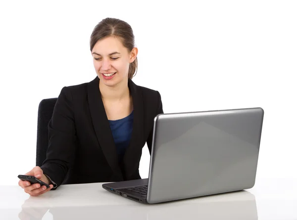 Attractive business woman looking on her smartphone — Stock Photo, Image