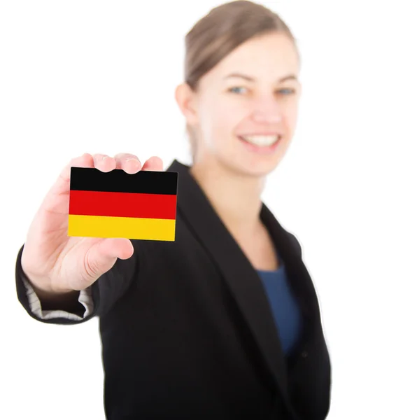 Mujer de negocios sosteniendo una tarjeta con la bandera alemana — Foto de Stock
