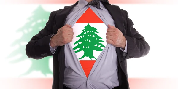 Деловой человек в ливанской футболке с флагом — стоковое фото