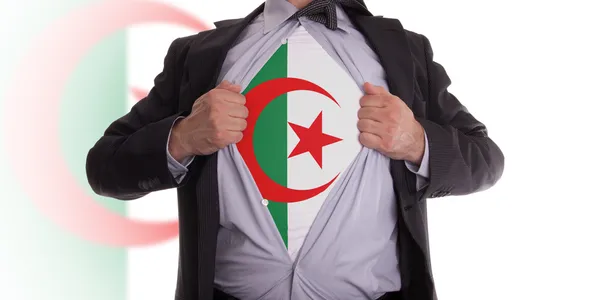 Homme d'affaires avec t-shirt drapeau algérien — Photo