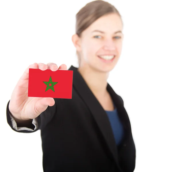 Business woman holding a card with the Moroccan flag — Stock Photo, Image
