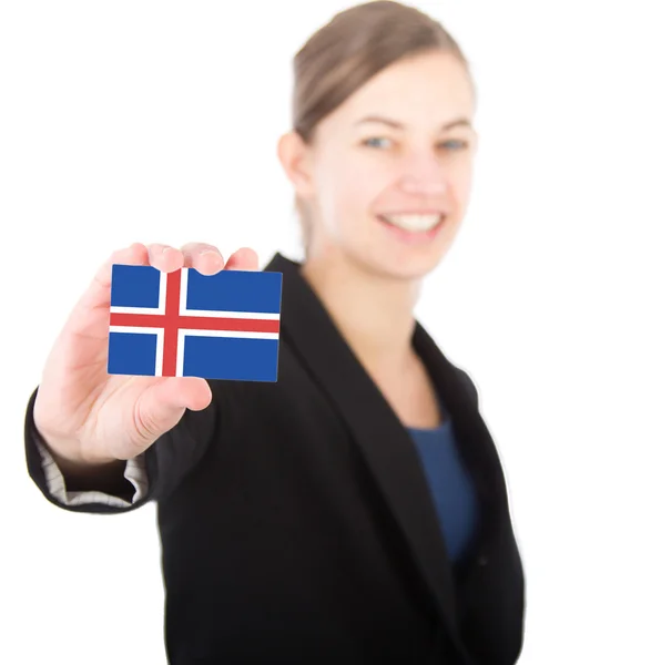 Business woman holding a card with the Icelandic flag — Stock Photo, Image