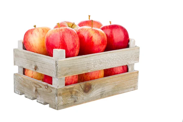 Freshly harvested apples in a wooden crate — Stock Photo, Image