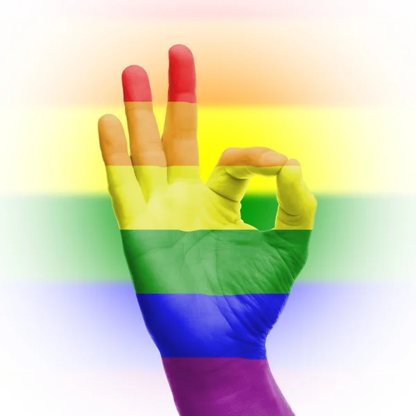 Hand ok bord met Regenboogvlag — Stockfoto