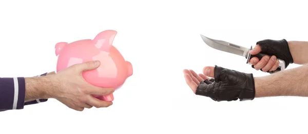 Robber with knife taking piggy bank from victim — Stock Photo, Image