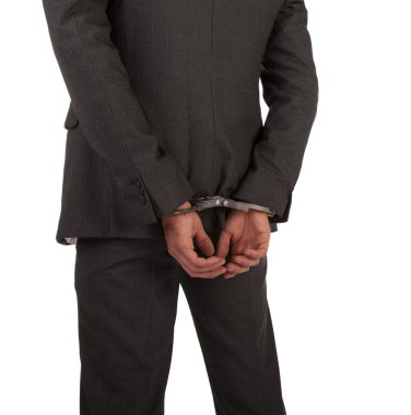 Businessman in suit and handcuffs clipart