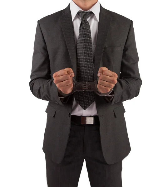 Businessman in suit and handcuffs — Stock Photo, Image