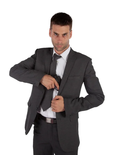 Uomo in giacca e cravatta afferrando pistola — Foto Stock