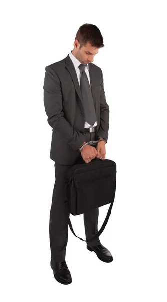 Businessman in handcuffs holding briefcase — Stock Photo, Image