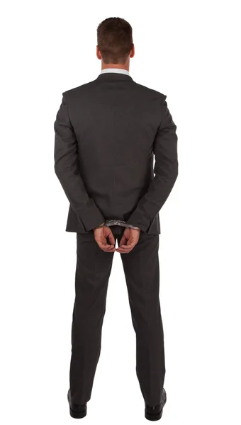 Businessman in suit and handcuffs — Stock Photo, Image