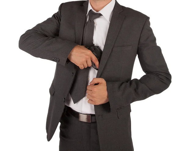 Άτομο σε ένα κοστούμι αρπάζοντας όπλο — Φωτογραφία Αρχείου