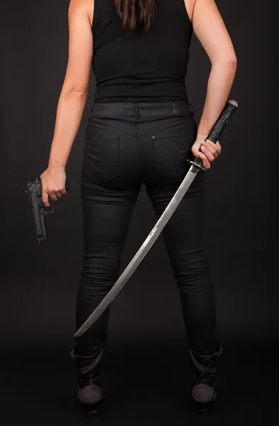 Nő a fegyvert és a kard Stock Fotó