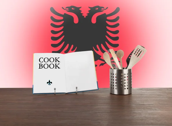 Cookbook and kitchen utensils with Albanian flag — Stock Photo, Image