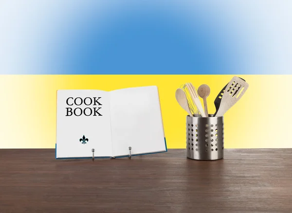 Cookbook and kitchen utensils with Ukrainian flag — Stock Photo, Image