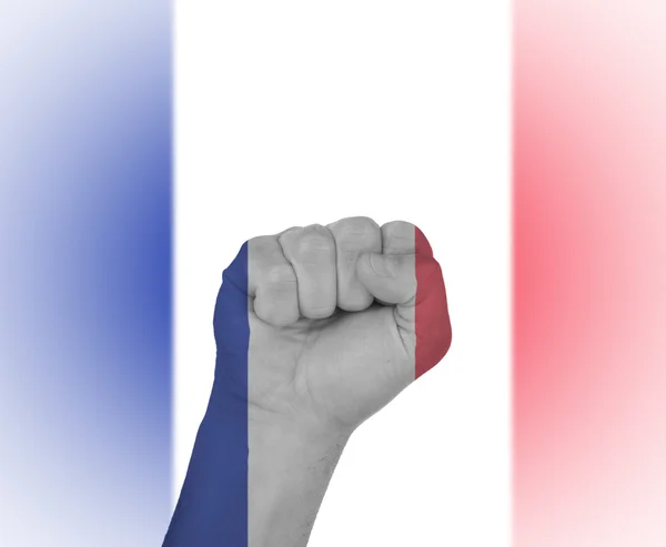 Punho embrulhado na bandeira da França — Fotografia de Stock