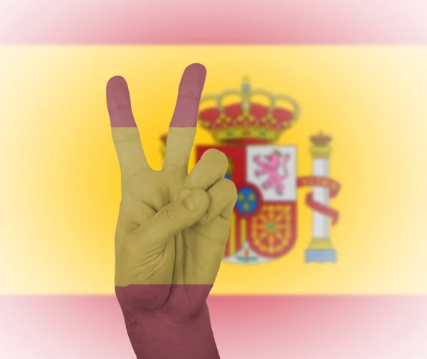 Χέρι το σημάδι ειρήνης με τη σημαία της Ισπανίας — Φωτογραφία Αρχείου