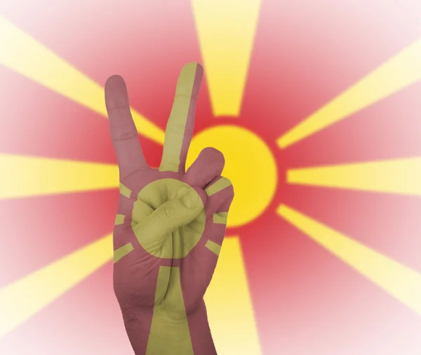 Hand peace sign with flag of Macedonia — Stock Photo, Image