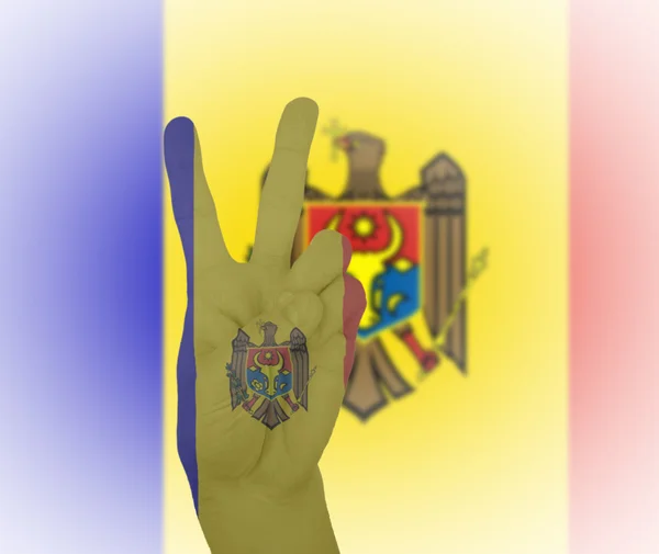 Hand peace sign with flag of Moldova — Stock Photo, Image