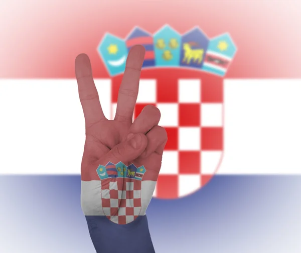 Signal de paix à la main avec drapeau de Croatie — Photo