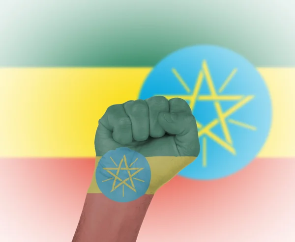 Fist wrapped in the flag of Ethiopia — Stock Photo, Image