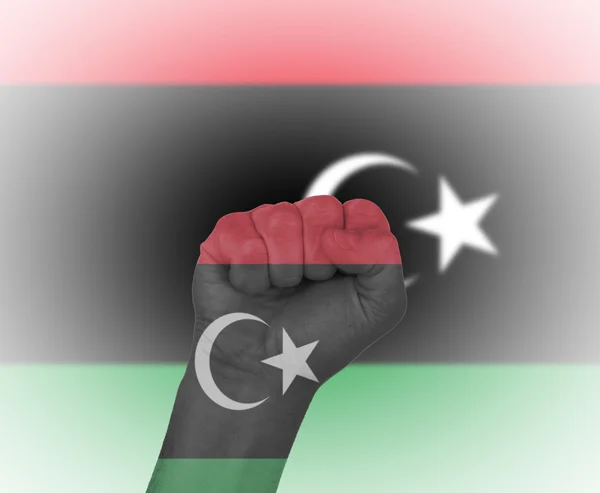 Fist wrapped in the flag of Libya — Stock Photo, Image