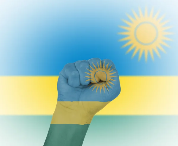 Fist wrapped in the flag of Rwanda — Stock Photo, Image