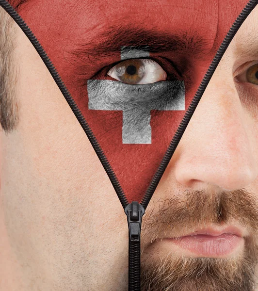 Unzipping face to flag of Switzerland — Stock Photo, Image