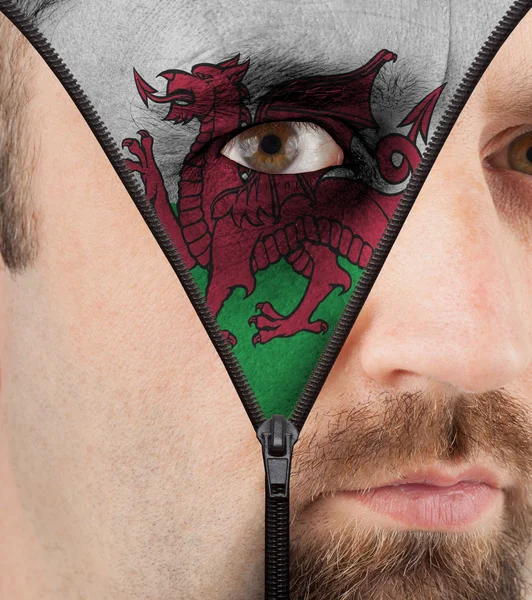 Unzipping face to flag of Wales — Stock Photo, Image