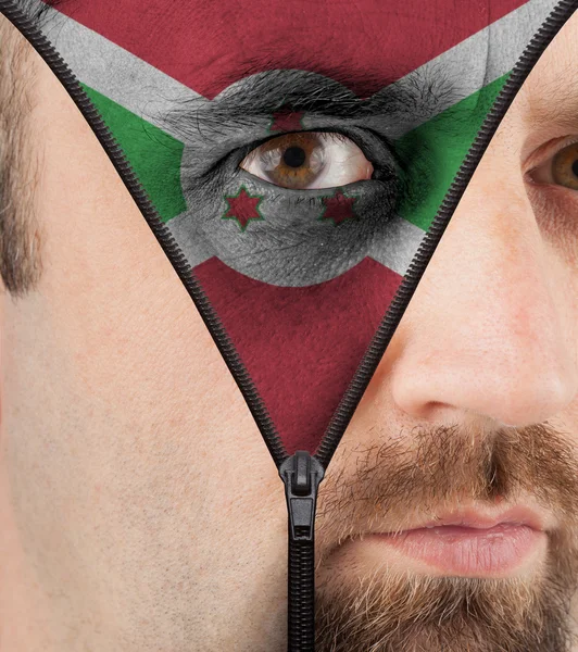 Unzipping face to flag of Burundi — Stock Photo, Image