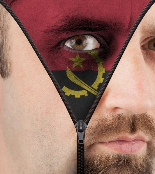 Unzipping face to flag of Angola — Stock Photo, Image