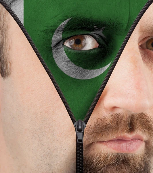 Unzipping face to flag of Pakistan — Stock Photo, Image